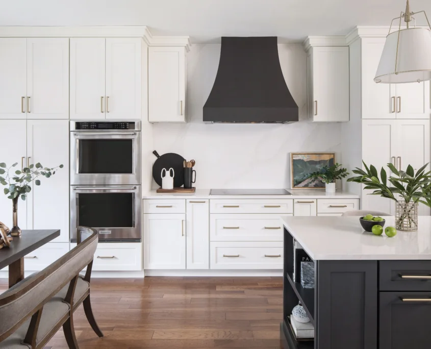 White kitchen with tailored dark range hood